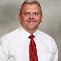 White man in a red tie