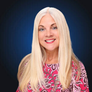 Blonde woman in pink top